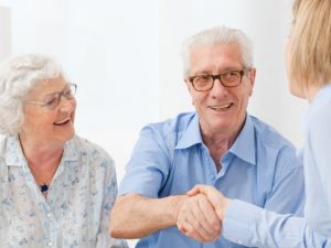 Doctor shaking hands with new patients